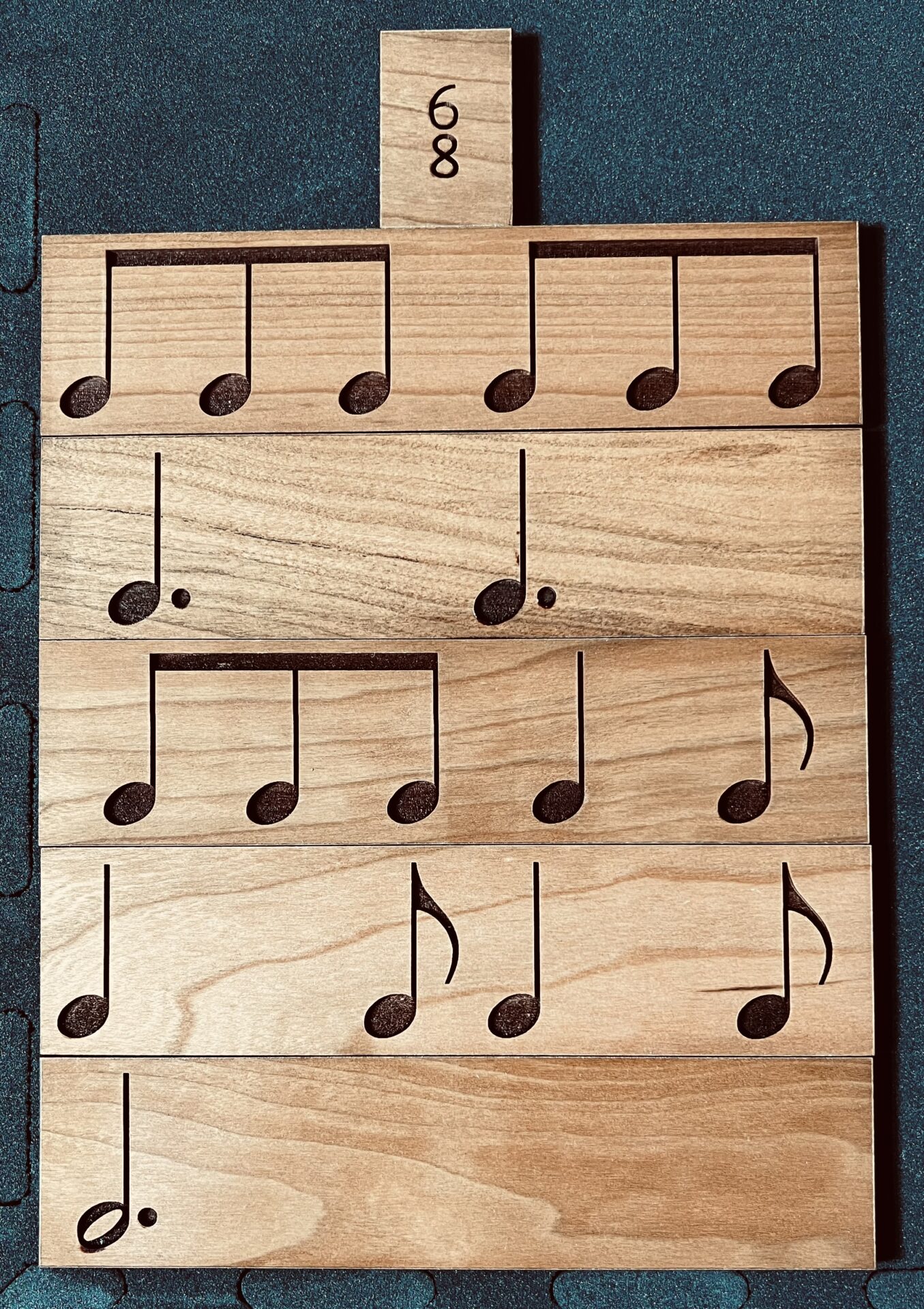 Long wooden blocks with musical notes