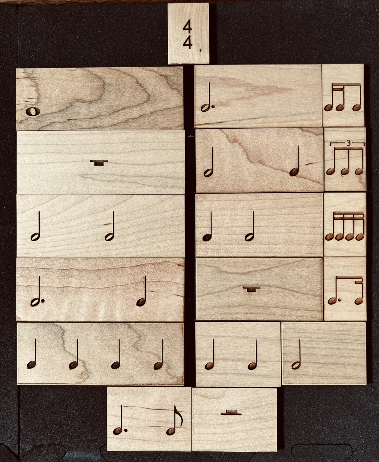 Small and big wooden blocks with musical notes